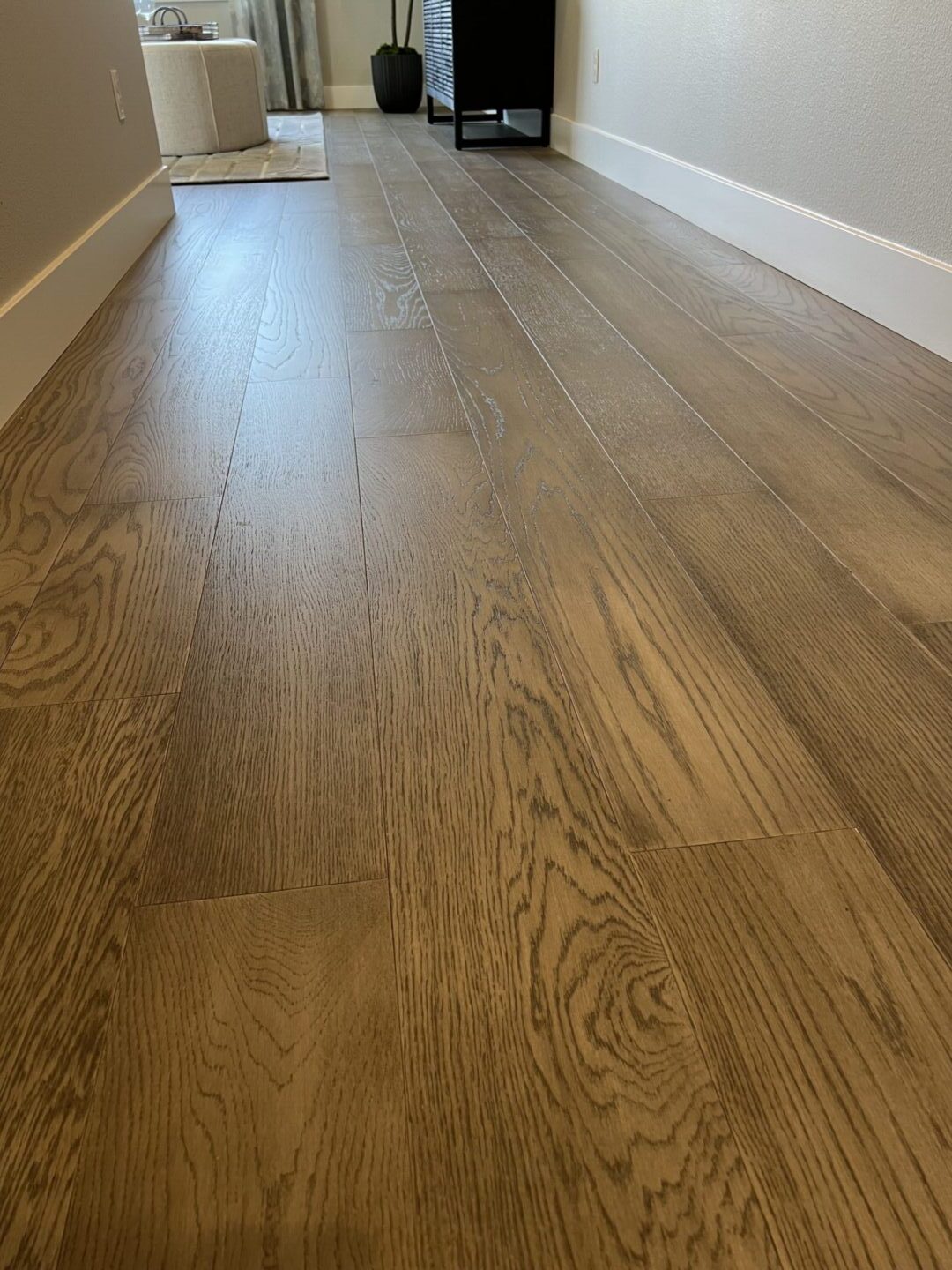 A wooden floor with some light wood on it