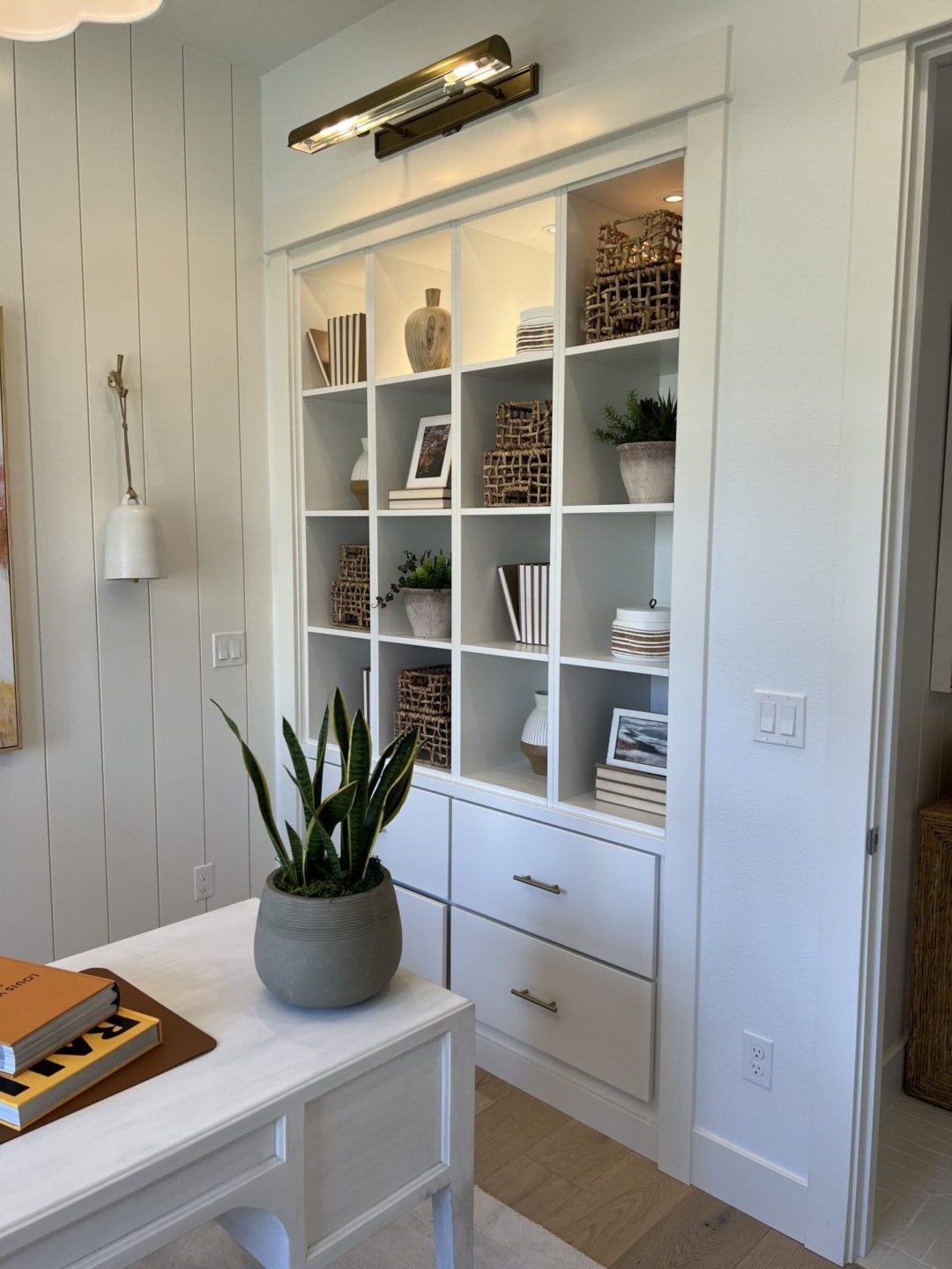 White built in shelves with drawers.